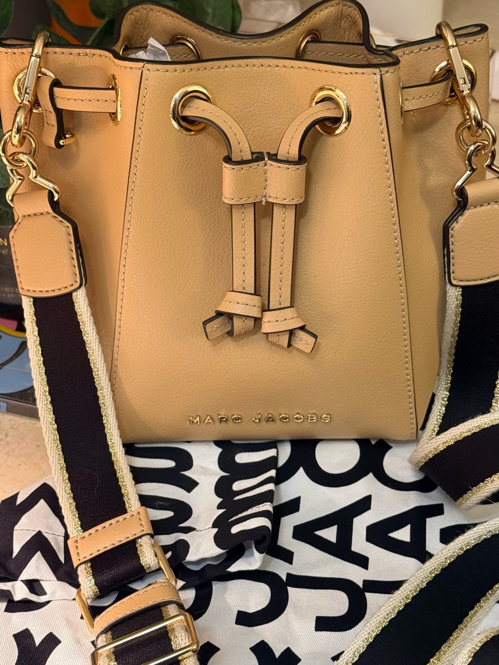 Marc Jacobs Tan Brown
Leather Black Strap
Gold Logo Small Drawstring 
Bucket Bag